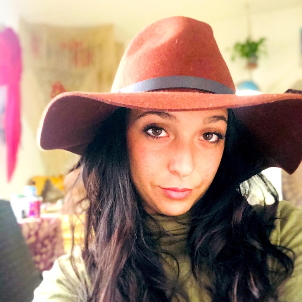 M floppy brimmed rust colored wool/felt hat.